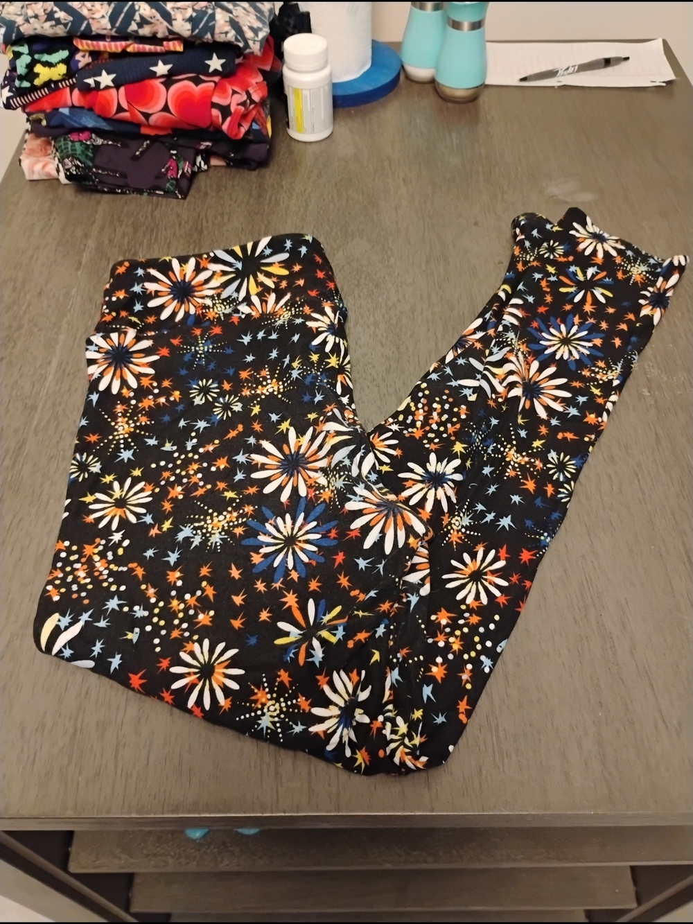 LuLaRoe Black Floral Starburst Leggings with White, Orange, Blue Accents